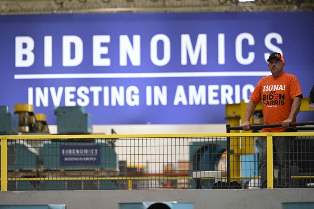 Employees listen to US President Joe Biden speak about Bidenomics in Milwaukee, Wisconsin, August 15, 2023. (Photo by ANDREW CABALLERO-REYNOLDS / AFP)