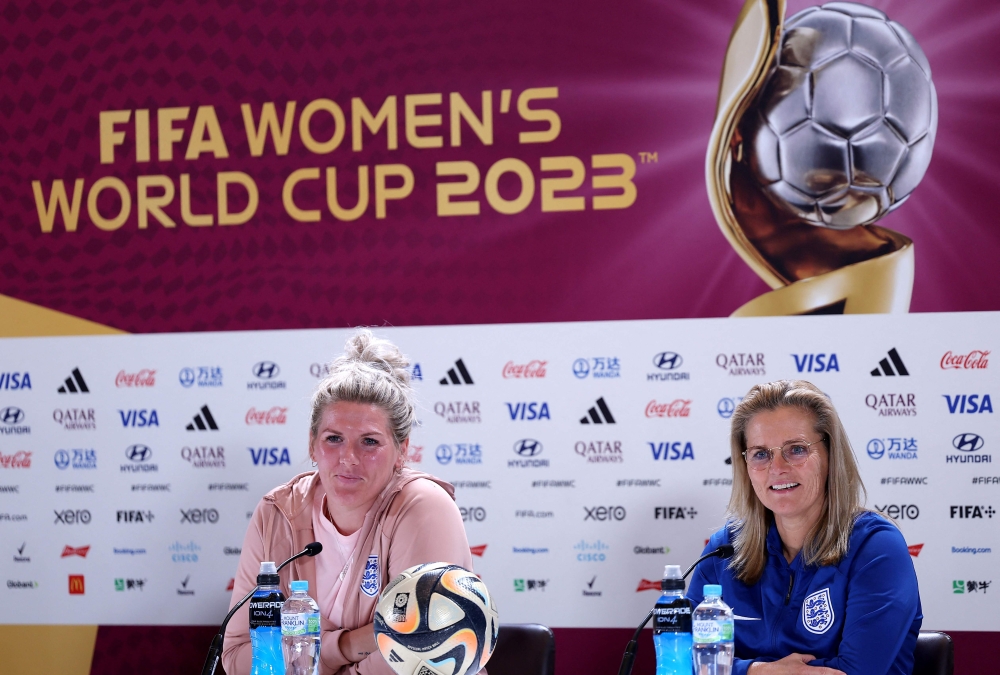 England's head coach Sarina Wiegman and defender Millie Bright (L) give a press conference at Stadium Australia in Sydney on August 19, 2023 on the eve of the Women's World Cup final football match between Spain and England. (Photo by Franck Fife / AFP)