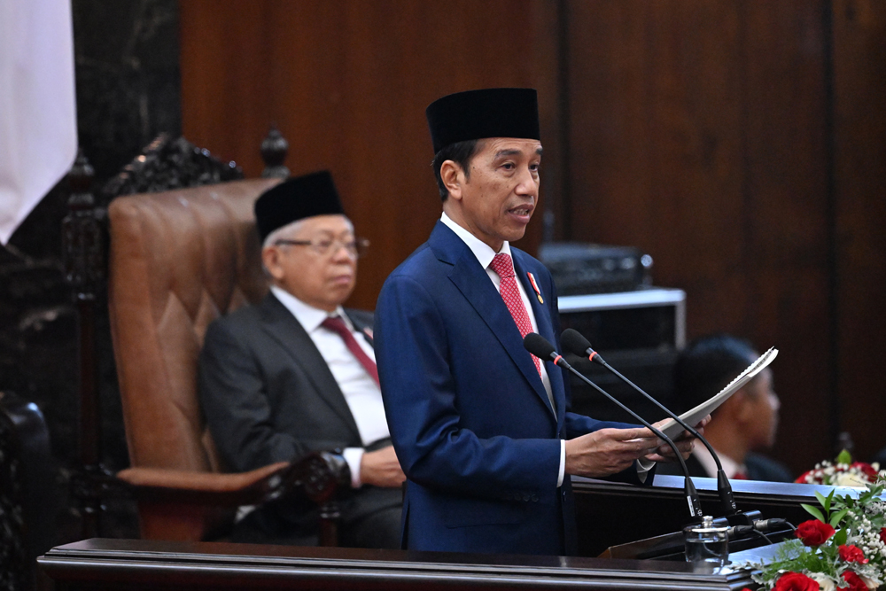Indonesia's President Joko Widodo delivers his speech on the budget, as Vice President Ma'ruf Amin (back) looks on, ahead of the country's Independence Day at the parliament building in Jakarta on August 16, 2023. Photo by ADEK BERRY / POOL / AFP
