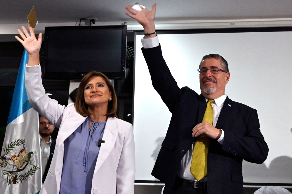 Guatemalan presidential candidate for the Movimiento Semilla party, Bernardo Arevalo, and his Vice President Karin Herrera celebrate the results of the presidential run-off election in Guatemala City, on August 20, 2023. (Photo by Luis Acosta / AFP)