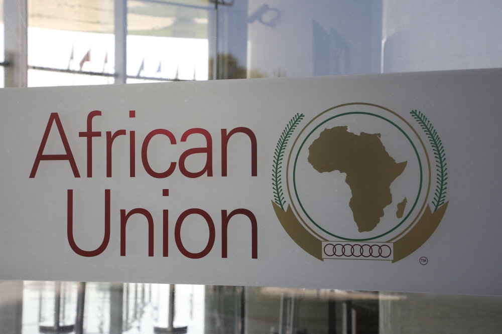 The logo of the African Union (AU) is seen at the entrance of the AU headquarters on March 13, 2019, in Addis Ababa. (Photo by Ludovic MARIN / POOL / AFP)
