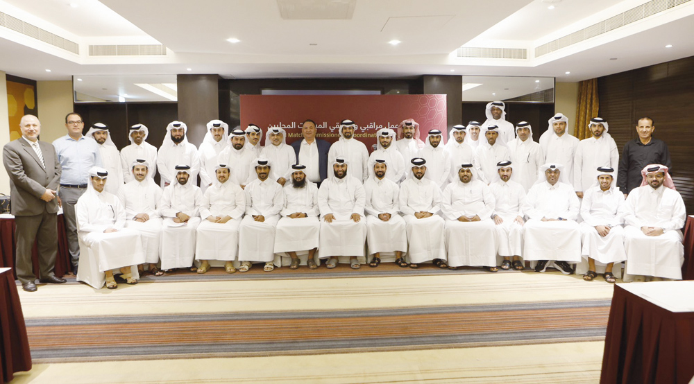 The participants of the local match observers and coordinators workshop pose for a photograph with the officials.