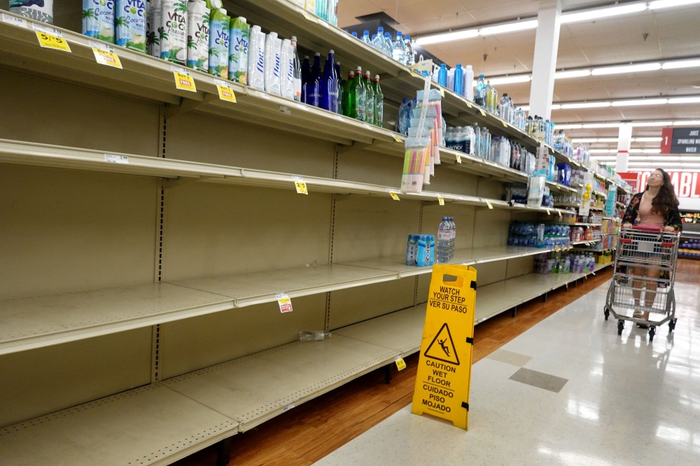 A grocery store's water section is almost bare as people stock up ahead of the possible arrival of Hurricane Idalia on August 29, 2023 in Pinellas Park, Florida. (Photo by Joe Raedle/Getty Images/AFP)