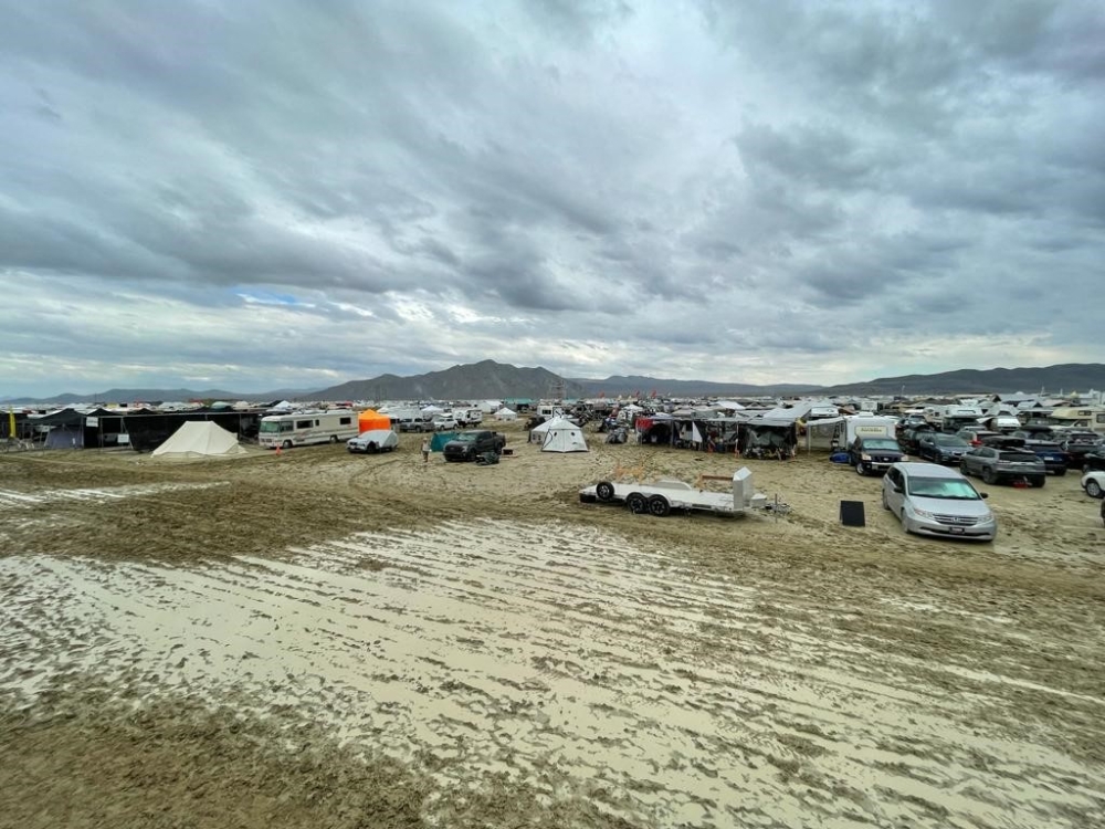 Camps are set on a muddy desert plain on September 2, 2023, after heavy rains turned the annual Burning Man festival site in Nevada Black Rock desert into a mud pit. Photo by Julie JAMMOT / AFP