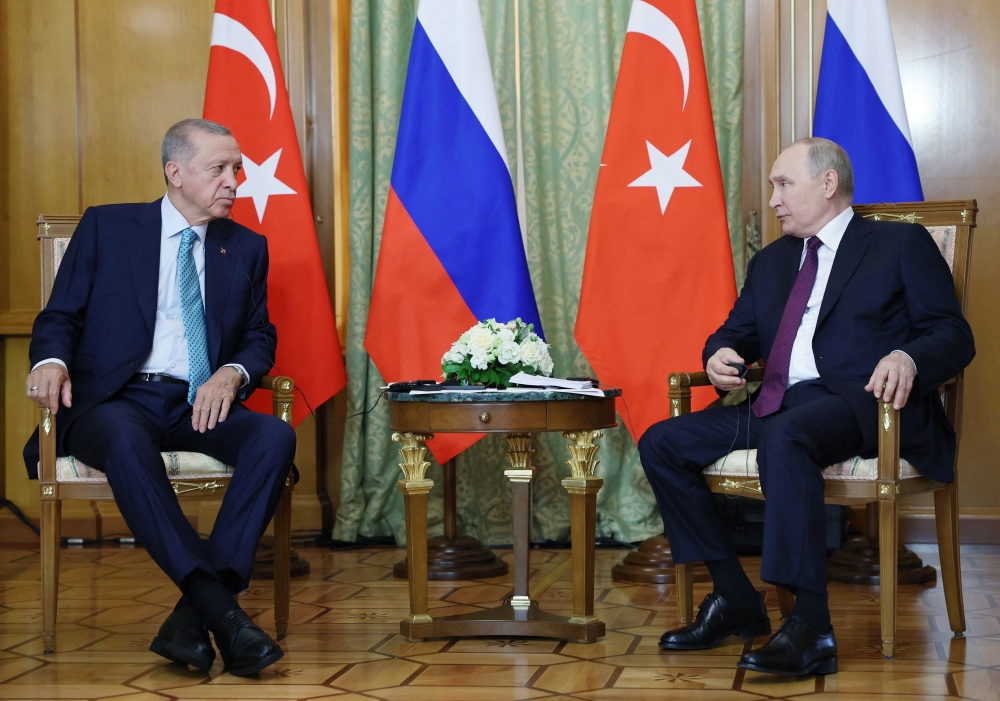 In this handout photograph taken and released by Turkish Presidential Press Office on September 4, 2023, Russian President Vladimir Putin (right) and Turkish President Recep Tayyip Erdogan attend a meeting in Sochi. (Photo by Murat Cetin Muhurdar / TURKISH PRESIDENTIAL PRESS SERVICE / AFP) 