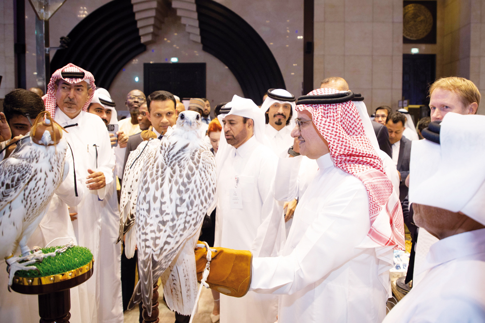 Katara General Manager, Prof. Dr. Khalid bin Ibrahim Al Sulaiti; Saudi Ambassador to Qatar H H Prince Mansour bin Khalid bin Abdullah Al Farhan Al Saud; and others view falcons on display on opening day of the Katara International Hunting and Falcons Exhibition yesterday.