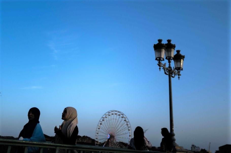 Women wearing an abaya walk on a bridge in the southwestern city of Toulouse, France. (Photo by Charly Triballeau / AFP)
