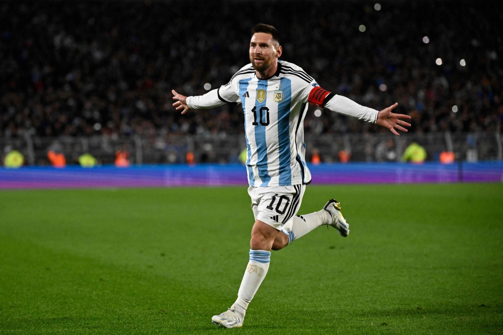 Argentina's forward Lionel Messi celebrates after scoring a goal during the 2026 FIFA World Cup South American qualifiers football match between Argentina and Ecuador, at the Mas Monumental stadium in Buenos Aires, on September 7, 2023. Photo by Luis ROBAYO / AFP