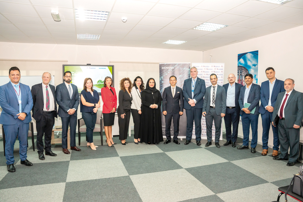 Founder and Chairperson of Al Faleh Educational Holding Dr. Sheikha Aisha bint Faleh Al Thani and Chief Executive Officer of Siemens in Qatar Hakan Ozdemir with other official during the MoU signing ceremony.