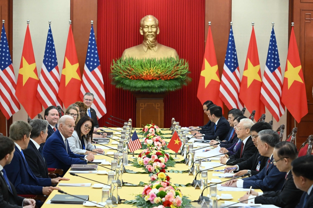 US President Joe Biden and Vietnam's Communist Party General Secretary Nguyen Phu Trong (5R) hold a meeting at the Communist Party of Vietnam Headquarters in Hanoi on September 10, 2023. (Photo by Saul Loeb / AFP)