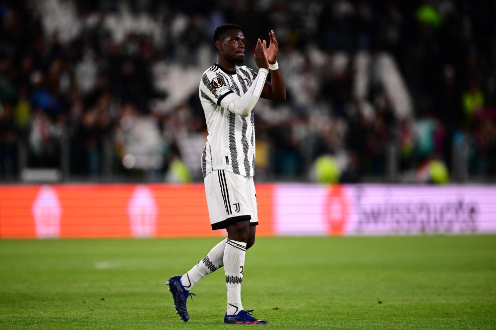 A picture taken on May 11, 2023 in Turin shows Juventus' French midfielder Paul Pogba acknowledging the public at the end of the UEFA Europa League semi-final first leg football match between Juventus and Sevilla.  (Photo by Marco Bertorello / AFP)
