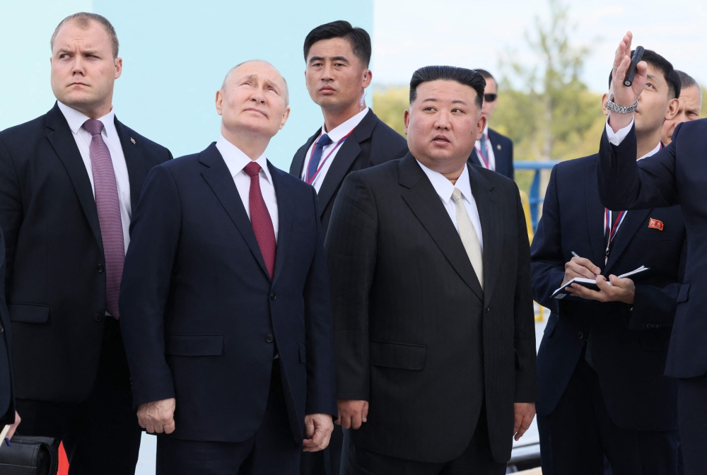 Russia's President Vladimir Putin (centre L) and North Korea's leader Kim Jong Un (centre R) visit the Vostochny Cosmodrome in Amur region on September 13, 2023. Photo by Mikhail Metzel  