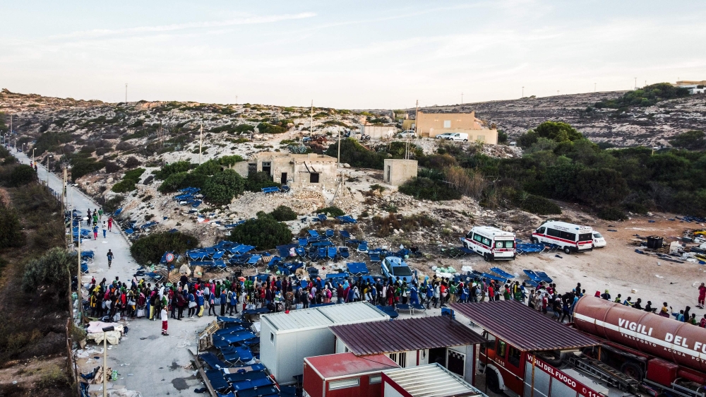 This aerial photograph taken on September 14, 2023 shows migrants gathering outside the operational center called 