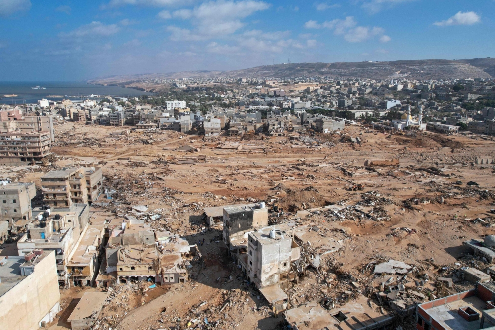 An aerial picture shows a view of the damage in the aftermath of a devastating flood in eastern Libya's city of Derna, on September 16, 2023. (Photo by AFP)