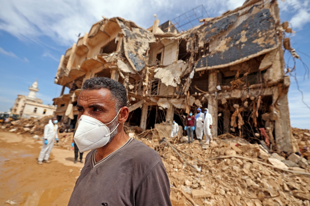 Rescue teams assist in relief work in Libya's eastern city of Derna September 17, 2023 following deadly flash floods. (Photo by Karim Sahib / AFP)