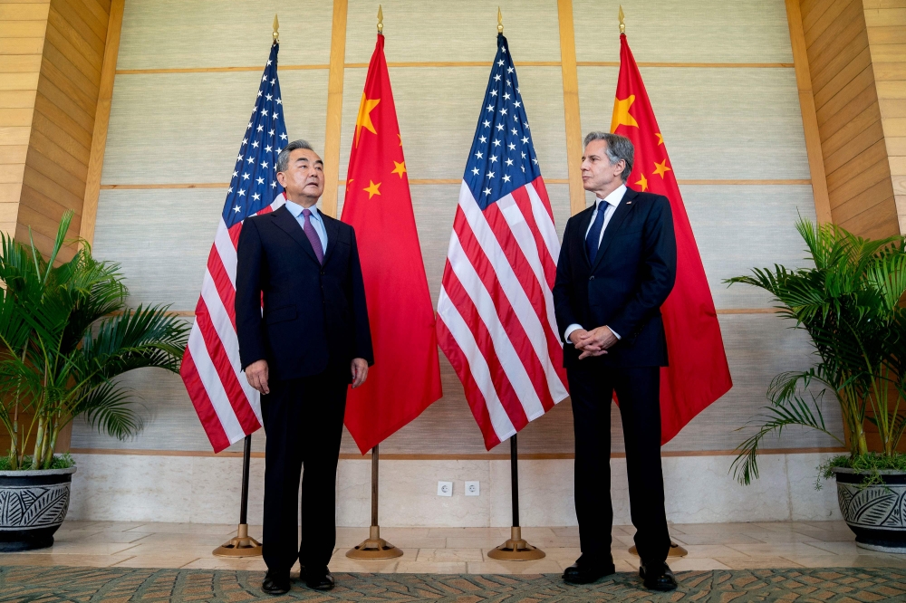 In this file photo taken on July 8, 2022, US Secretary of State Antony Blinken (right) and China's Foreign Minister Wang Yi attend a meeting in Nusa Dua on the Indonesian resort island of Bali. (Photo by Stefani Reynolds / POOL / AFP)
