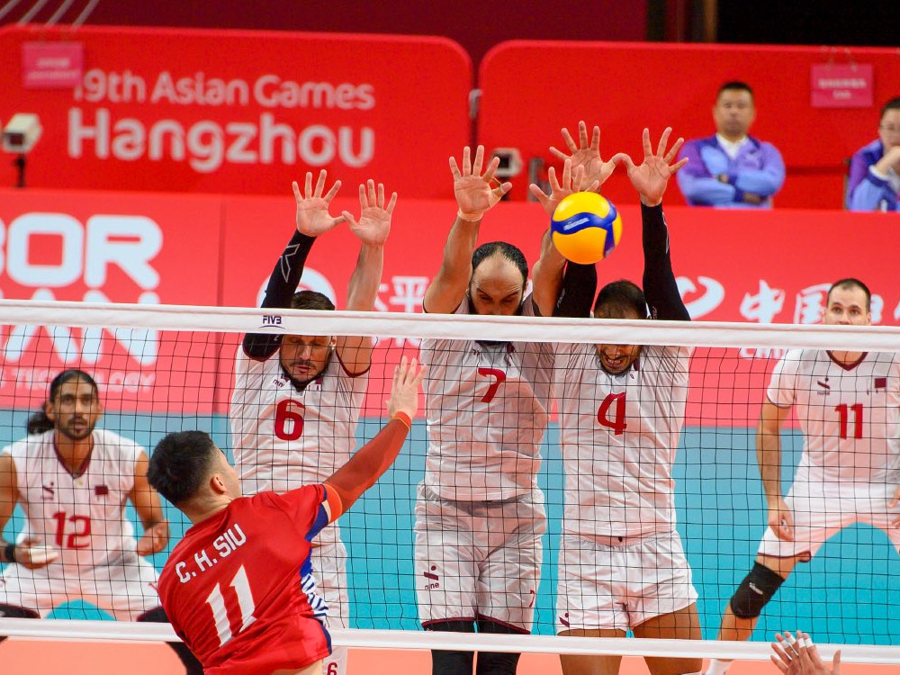 Action during volleyball game between Qatar and Hong Kong. 