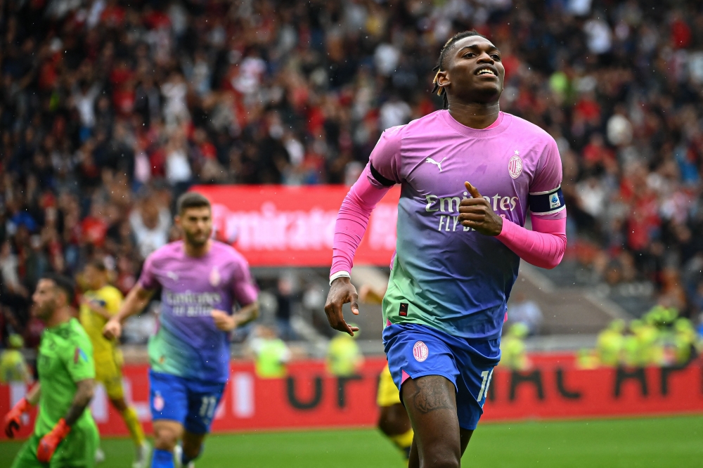 AC Milan's Portuguese forward #10 Rafael Leao celebrates after scoring during the Italian Serie A football match between AC Milan and Hellas Verona at San Siro stadium in Milan, on September 23, 2023. (Photo by Piero CRUCIATTI / AFP)
