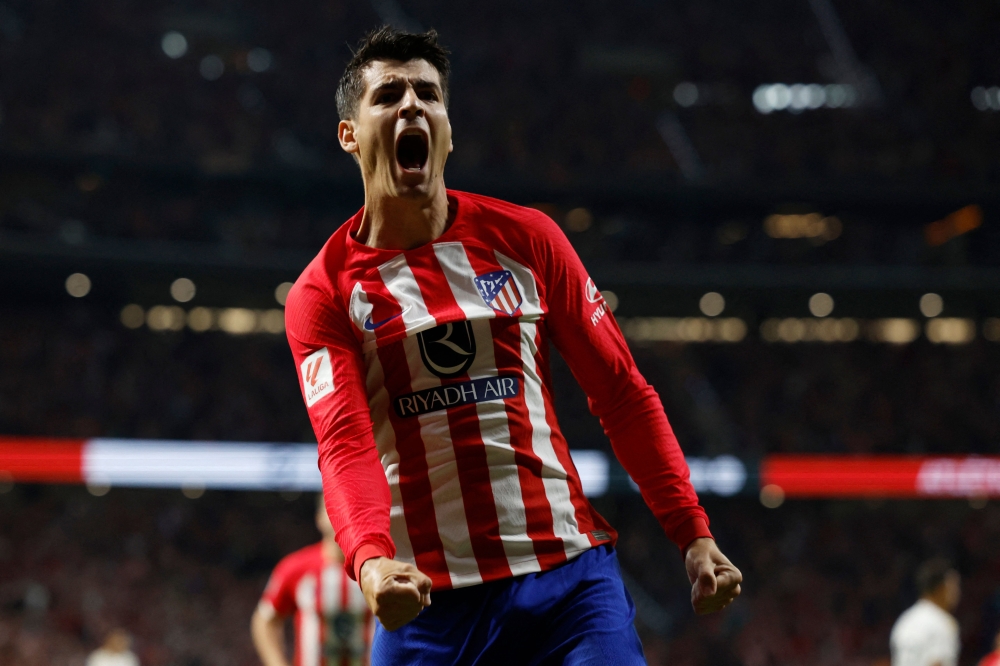 Atletico Madrid's Spanish forward #19 Alvaro Morata celebrates scoring the opening goal during the Spanish Liga football match between Club Atletico de Madrid and Real Madrid CF at the Metropolitano stadium in Madrid on September 24, 2023. (Photo by Oscar DEL POZO / AFP)
