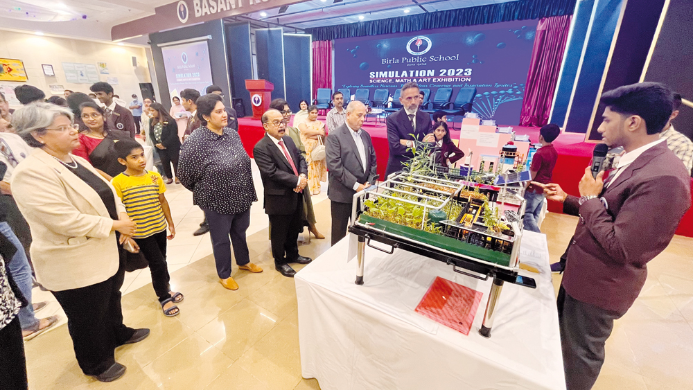 Officials of Birla Public School with guests touring the exhibition.