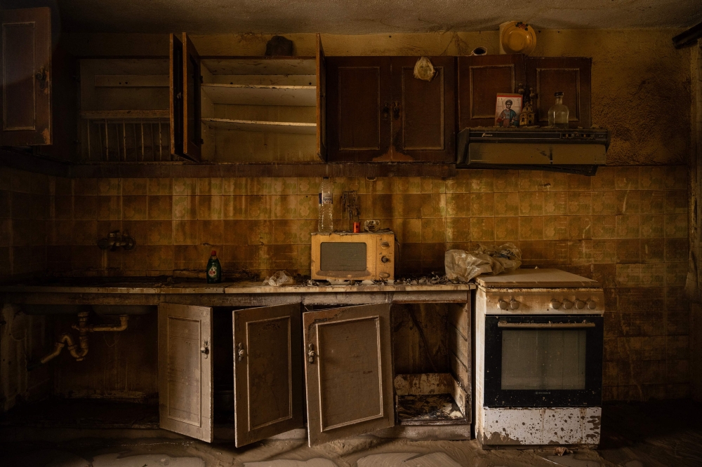 This photograph taken on September 25, 2023 shows the kitchen of a devastated house after the floodwater from Storm Daniel receded, in the village of Vlochos, central Greece. Photo by Angelos TZORTZINIS / AFP