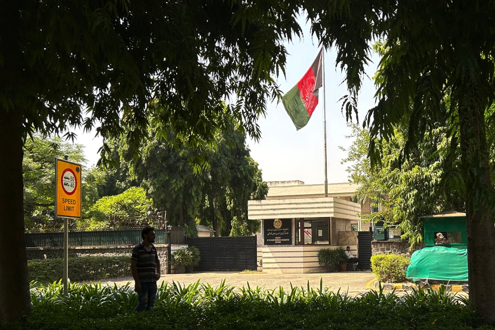 An Afghan national stands outside the embassy of the Islamic Republic of Afghanistan in New Delhi on September 29, 2023. (Photo by Arun Sankar / AFP)