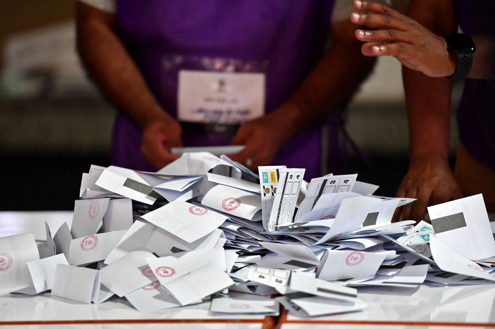 Officials prepare to count votes at a polling station during the second round of Maldives' presidential election in Male on September 30, 2023. (Photo by Mohamed Afrah / AFP)
