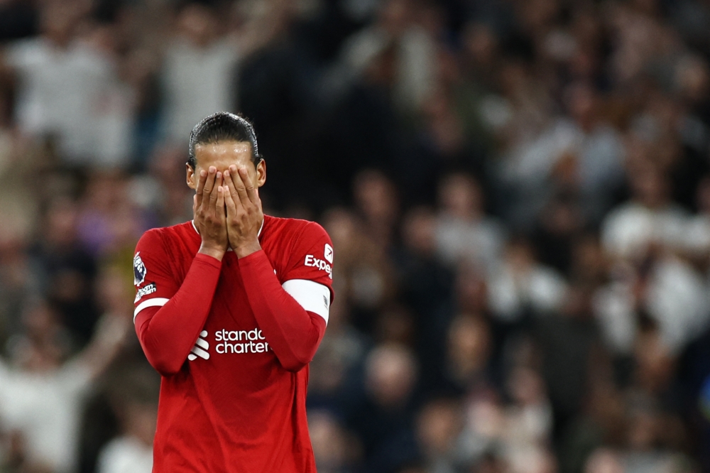 Liverpool's Dutch defender #04 Virgil van Dijk reacts at the end of the English Premier League football match between Tottenham Hotspur and Liverpool at Tottenham Hotspur Stadium in London, on September 30, 2023. Tottenham Hotspur wins 2 - 1 against Liverpool. (Photo by HENRY NICHOLLS / AFP)