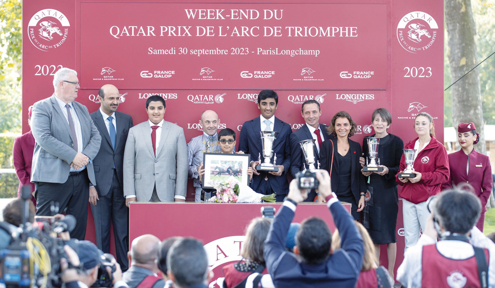 Qatar Racing and Equestrian Club's Board Member Khalifa bin Mohammed Al Attiyah (second left) presented the trophies to the winners of the Gr1 PA Qatar Arabian Trophy Des Juments after Olivier Peslier guided Al Shaqab Racing's Nour Al Maury to victory, yesterday. 