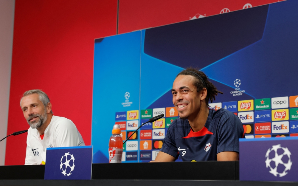 Leipzig's German head coach Marco Rose (L) and Leipzig's Danish forward #09 Yussuf Poulsen attend a press conference on the eve of the UEFA Champions League football match between RB Leipzig and Manchester City in Leipzig, on October 3, 2023. (Photo by Odd Andersen / AFP)
