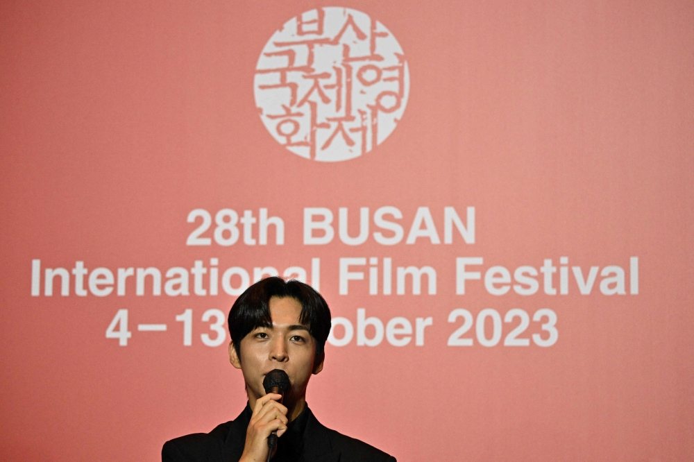 Actor Joo Jong-hyuk speaks during a press conference following the screening of ‘Because I Hate Korea’, the opening film for the 28th Busan International Film Festival (BIFF), at the Busan Cinema Center in Busan on October 4, 2023. Photo by Anthony WALLACE / AFP