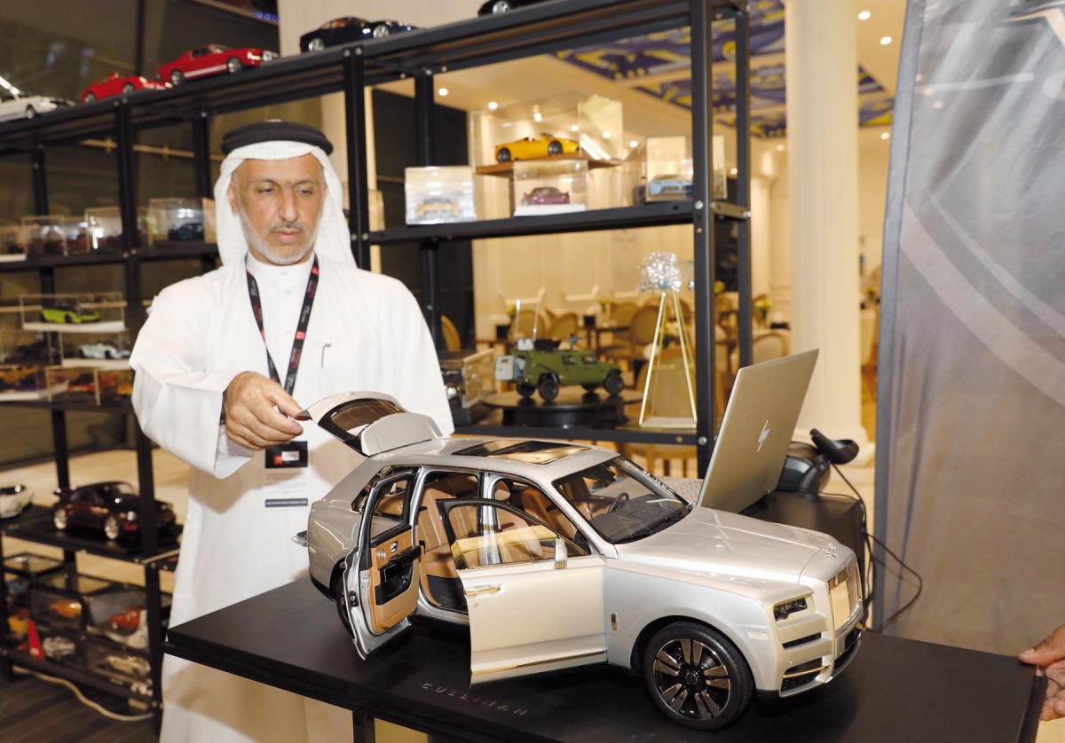 Mohammed Al Najjar with one of his diecast cars at Geneva International Motor Show. Pics: Salim Matramkot/The Peninsula