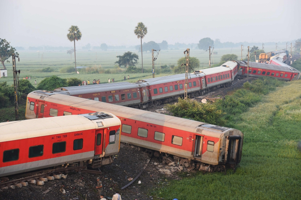 A general view shows damaged carriages near Raghunathpur railway station some 44 Km from Buxar on October 12, 2023, after an express train derailed late on October 11 in India's Bihar state. Photo by Sachin KUMAR / AFP