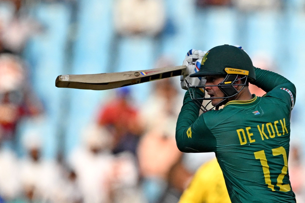 South Africa's Quinton De Kock rests during the 2023 ICC Men's Cricket World Cup one-day international (ODI) match between Australia and South Africa at the Ekana Cricket Stadium in Lucknow on October 12, 2023. (Photo by TAUSEEF MUSTAFA / AFP)