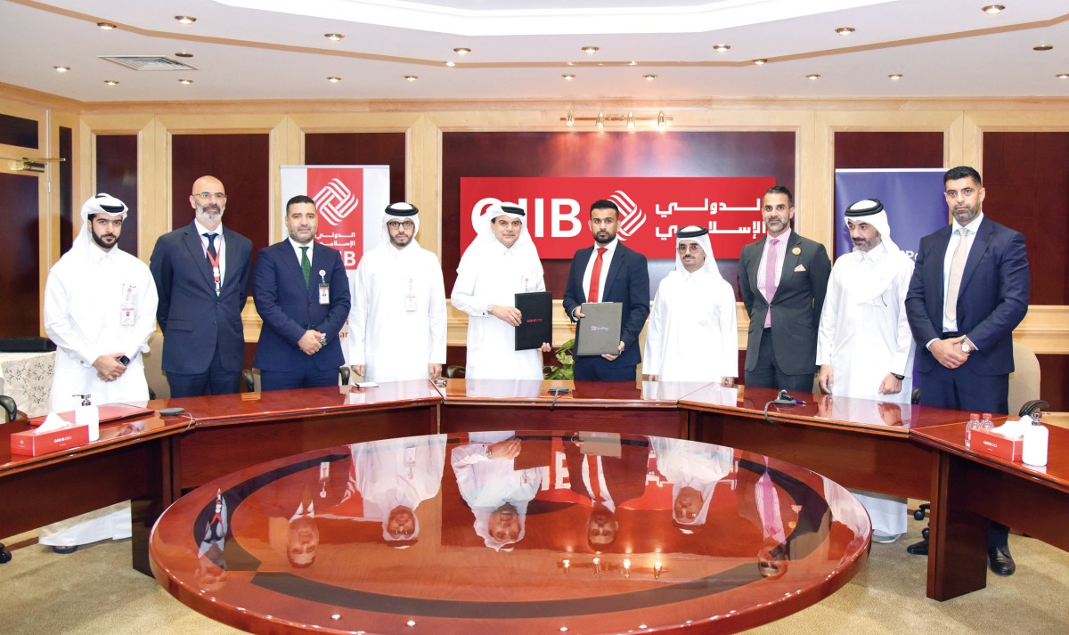 QIIB CEO, Dr. Abdulbasit Ahmad Al Shaibei ; FynPay and PeyzBank Group Chief Executive Officer and Co-Founder, Rauf Azam with other officials at the MoU signing at QIIB headquarters.