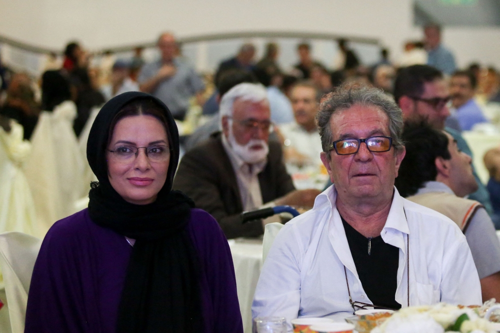 (FILES) Iranian film director Dariush Mehrjui and his wife Vahida Mohammadifar attend a ceremony in Tehran on July 1, 2015. (Photo by Abdulwahed MIRZAZADEH / isna news / AFP)
