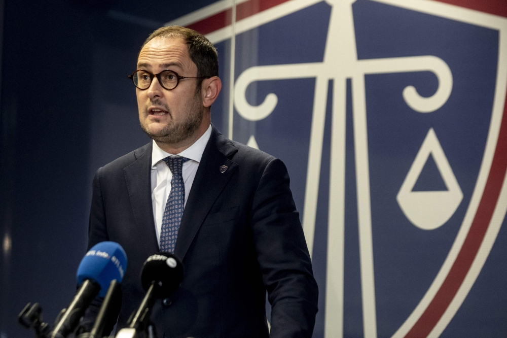 Belgium's Justice Minister Vincent Van Quickenborne announces his resignation during a press conference following the October 16 attack in which two Swedish citizens died ahead of a Euro 2024 qualifying football match, in Brussels on October 20, 2023. (Photo by Hatim Kaghat / Belga / AFP)