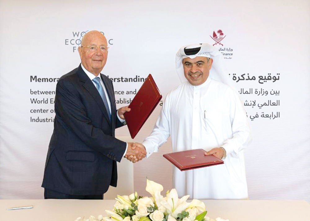 Minister of Finance, H E Ali bin Ahmed Al Kuwari with Executive Chairman of World Economic Forum, Professor Klaus Schwab at the agreement signing.