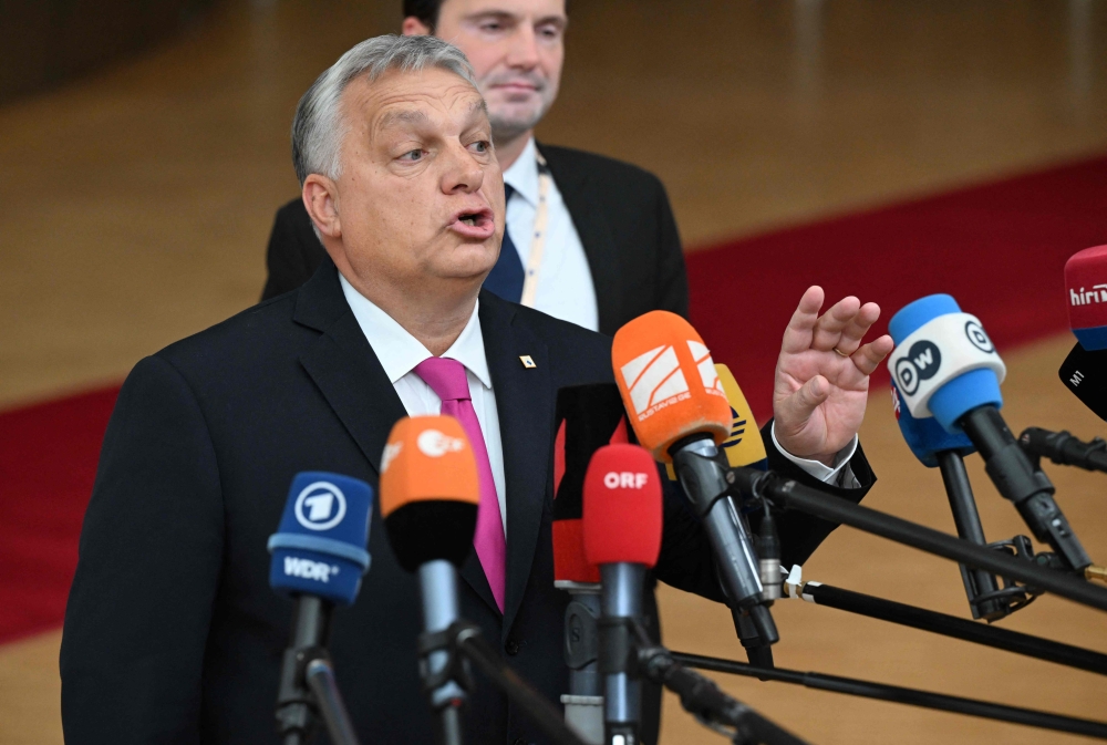 Hungary's Prime Minister Viktor Orban addresses the press as he arrives for a EU leaders Summit at The European Council Building in Brussels on October 26, 2023. (Photo by JOHN THYS / AFP)
