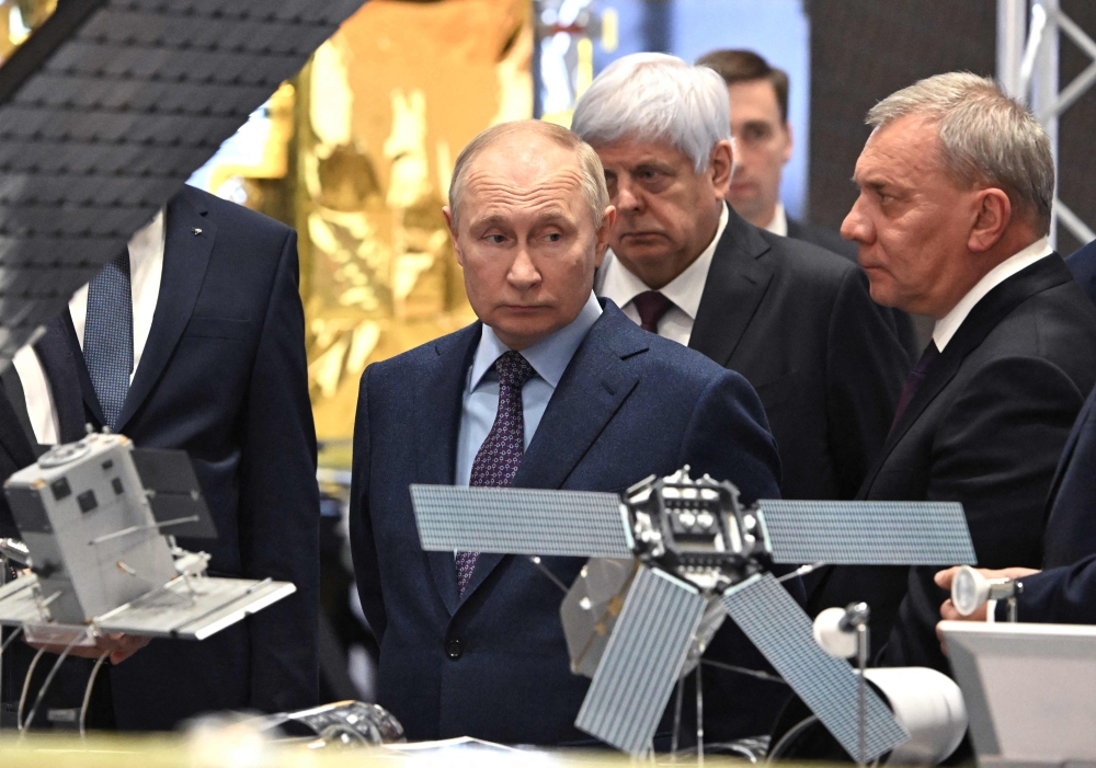 This pool photograph distributed by Russian state owned agency Sputnik shows Russia's President Vladimir Putin visiting the Rocket and space Corporation (RSC) Energia in Korolyov, outside Moscow, on October 26, 2023. (Photo by Grigory Sysoyev / POOL / AFP)