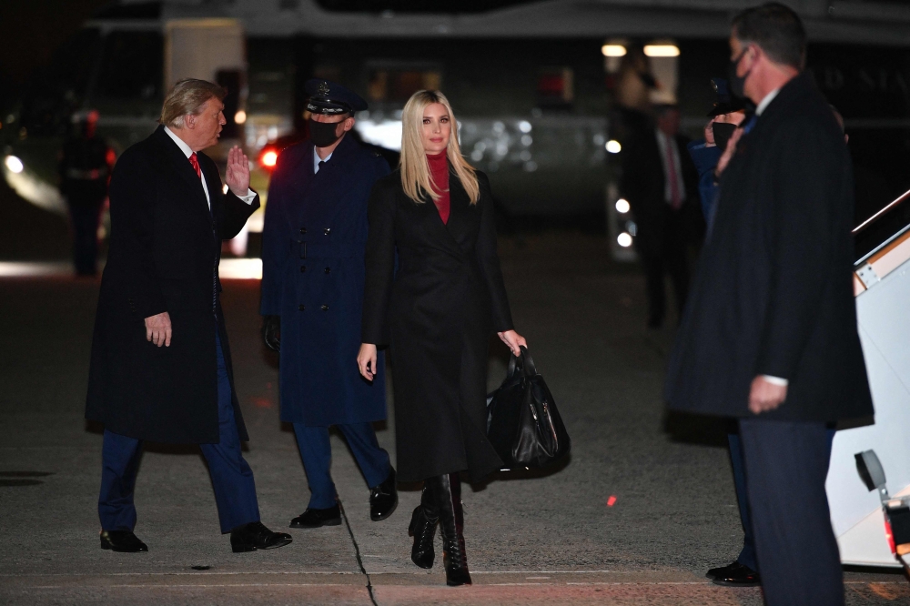 Former US President Donald Trump gestures during a break at court as he testifies during a fraud trial in New York City on October 25, 2023. (Photo by TIMOTHY A. CLARY / AFP)
