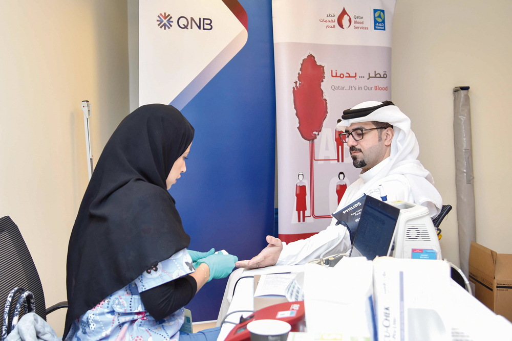 A staff donating blood during the campaign.