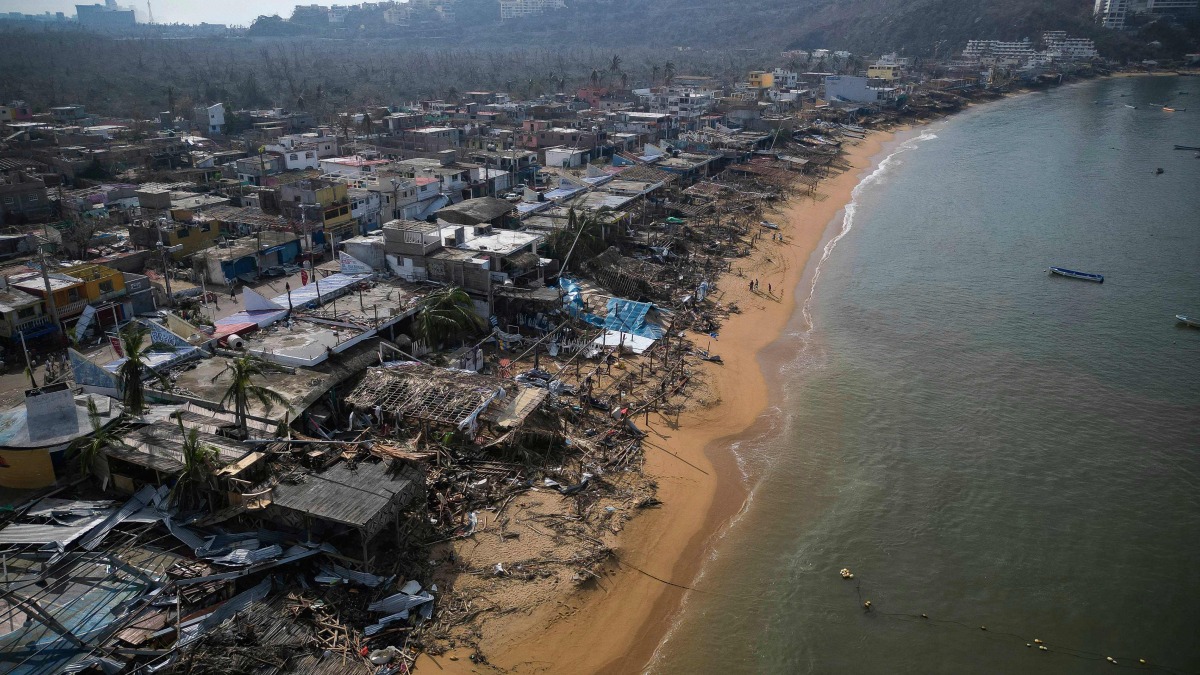 Aerial view of damages caused by the passage of Hurricane Otis in Puerto Marques, Guerrero State, Mexico, on October 28, 2023. (Photo by Rodrigo OROPEZA / AFP)