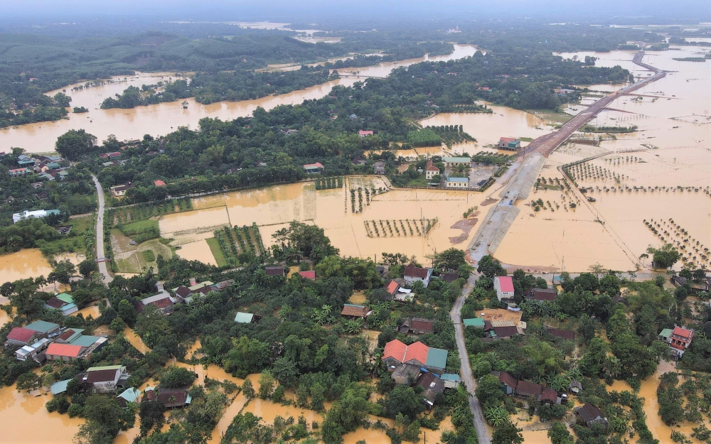 This aerial photo shows flooded houses in Huong Khe district in central Vietnam's Ha Tinh province on October 31, 2023. Photo by Ha Linh / AFP