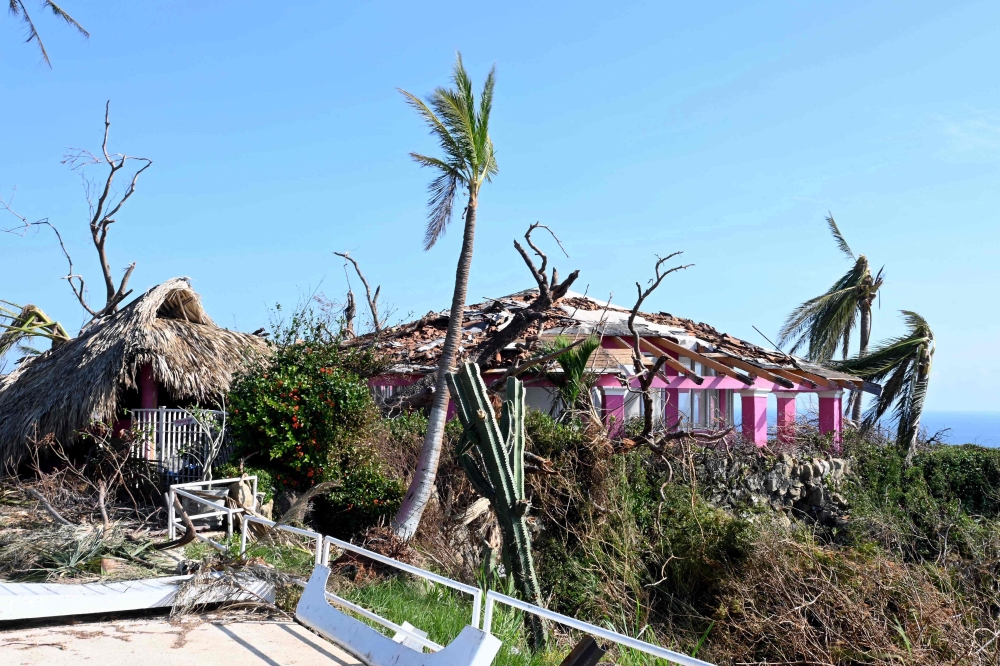 Damages caused by Hurricane Otis to the so-called Tarzan House, the former residence of US actor Johny Weissmuller, famous for representing 'Tarzan' in numerous films-- located at the Los Flamingos hotel, in Acapulco, state of Guerrero, Mexico, taken on October 31, 2023. (Photo by Francisco Robles / AFP)