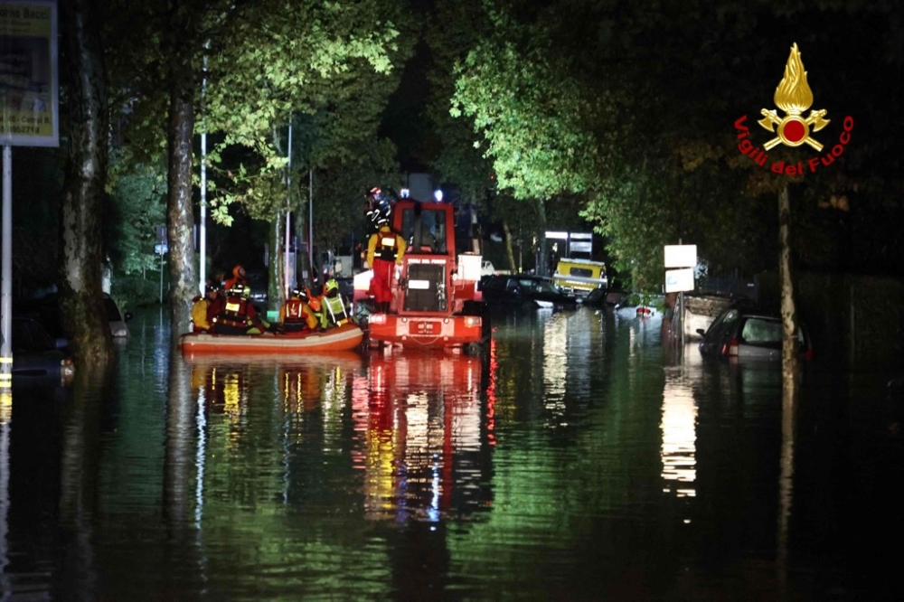 This photo taken and handout on November 3, 2023 by the Vigili del Fuoco, the Italian Corps. of Firefighters, shows Italian firefighters working to evacuate people from flooded houses in Campi Bisenzio, near Florence, after the storm Ciaran hit Tuscany, late on November 2, 2023. Photo by Handout / Vigili del Fuoco / AFP
