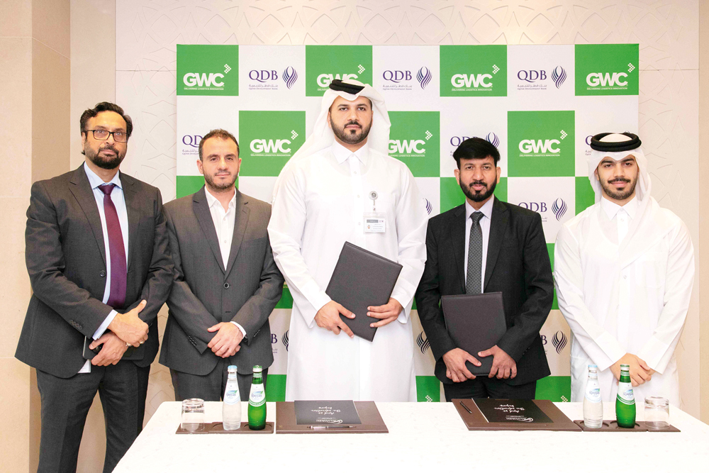 GWC Chief Operating Officer Rajeswar Govindan and QDB Executive Director of Advisory and Business Incubations Dr Hamad Mejegheer with other officials during the agreement signing.