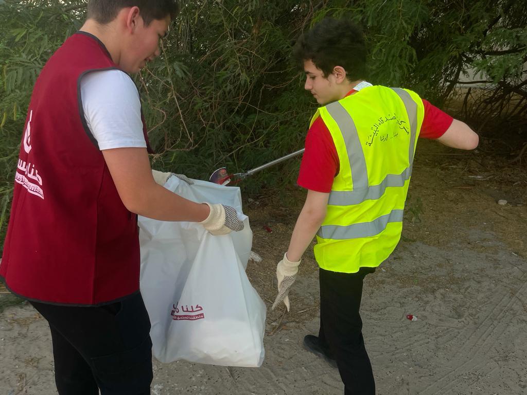 Youngsters participate in a cleanup activity organised by Al Rayyan Club to mark Qatar Sustainability Week.