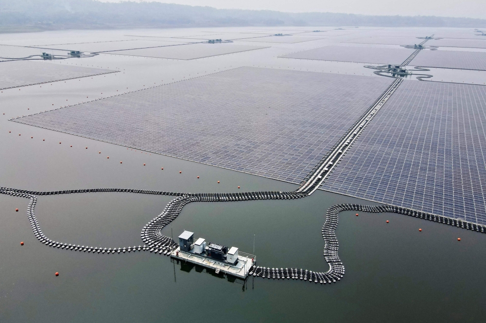 This aerial picture shows the newly built floating solar power plant on the water at Cirata Reservoir, West Java, on November 9, 2023, shortly before being inaugurated by President Joko Widodo. (Photo by Bay Ismoyo / AFP)