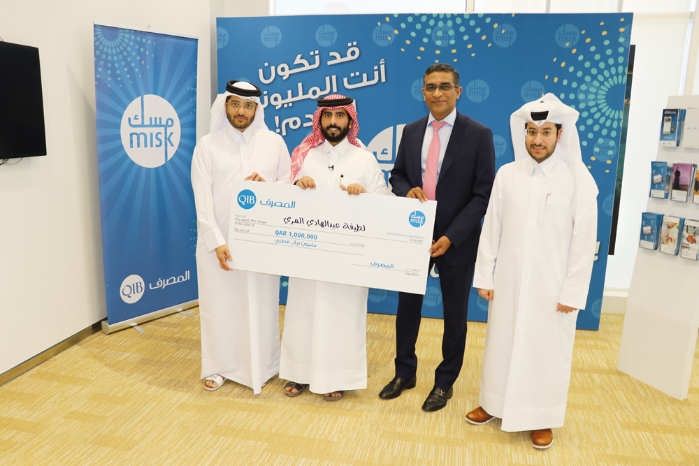 Saleh Hamad Al-Marri receives prize on behalf of his mother Latifa Abdulhadi Al-Marri in presence of QIB’s General Manager – Personal Banking Group, D Anand and other officials.
